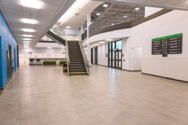 The main atrium in the H.G.R. Mews with the stairs to the second floor, lots of public washrooms, seating areas and access to the gymnasium. 